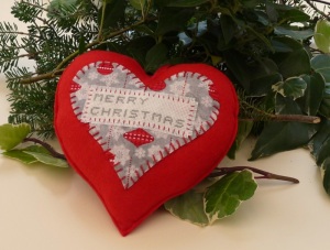 red felt Christmas heart laying